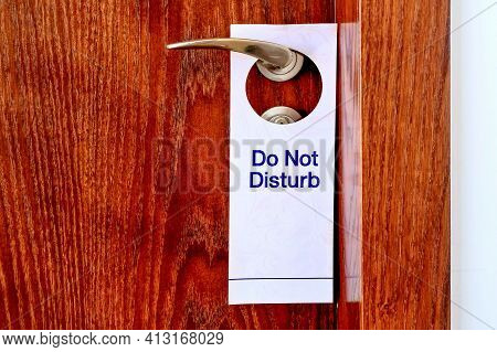Do Not Disturb Sign Hang On Door Knob. Do No Disturb Sign At Hotel Room Door. Close-up