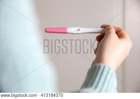 Young Woman Holding Negative Pregnancy Test,home Pregnancy Test Showing Negative Result Close Up