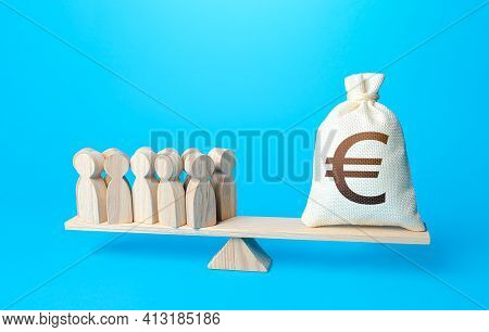 Group Of People And Euro Money Bag On Weight Scales. Required Payment Of Staff Salaries. Staff Maint