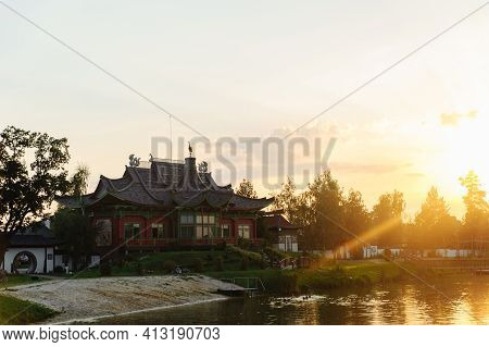 Building In The Chinese Style Over The River On The Sunset. Brech Complex, Chernihiv Region. Place F