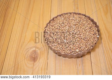 Buckwheat On Wooden Background - Buckwheat Benefits. Copy Space