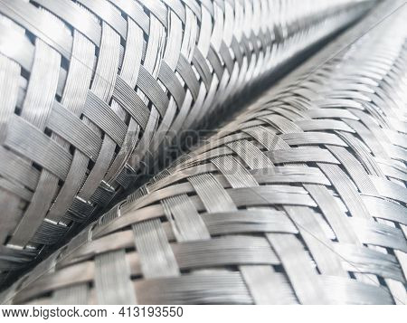Long Metal Flexible Compensator Pipes Metal Texture Closeup. Selective Focus. White Metal Industrial