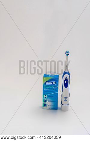 Daejeon, South Korea: March 16, 2021: Oral-b Super Floss And Electric Toothbrush On White Background