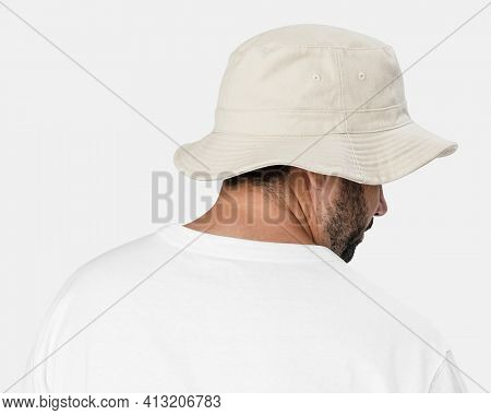 Man wearing bleached bucket hat, rear view