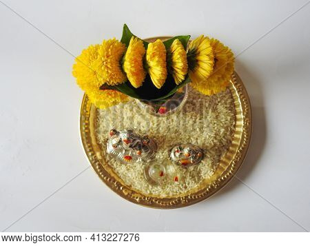 Closeup Of Silver Kalash Decorated With Chrysanthemum Flower, Leaf, Coconut, Kumkum And Turmeric Wit