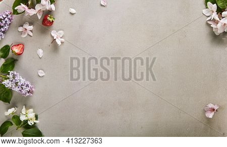 Floral Background made with Spring Flower on Textured Table. Lilac and White Flower minimal Composition. 8 march, mother day, spring holidays layout