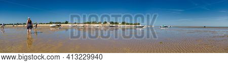 Panorama Of People Looking For Crustaceans At Low Tide In Les Portes-en-ré On The Isle Of Ile De Re 