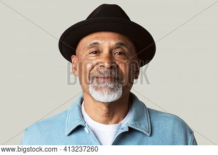 Mature man smiling face closeup portrait on green background