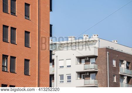 Abstract View Of A Row Of Modern Apartment Buldings, Multi Stories, With Balconies And Contemporary 