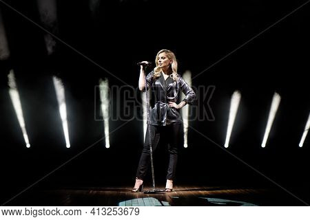 Young Beautiful Woman Singing In Whitel Smoke, Close Up.