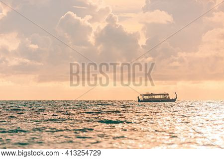 Sunset Sea With Maldivian Boat Dhoni. Calm Sea And Soft Sunset Light, Relaxing Blue Sky. Exotic Trop