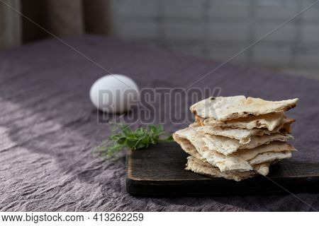 Homemade Matzo  With Microgreen Peas. Unleavened Flatbread Bread. Pesah Celebration Concept.  Jewish