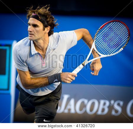MELBOURNE - 19 gennaio: Roger Federer in Svizzera nella sua terza vittoria rotonda sopra Berbard Tomic A