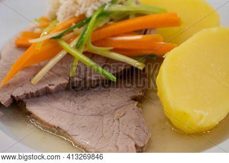 Stewed Pork With Root Vegetable Julienne Of Carrots, Leeks, Horseradish And Potatoes Called Steirisc