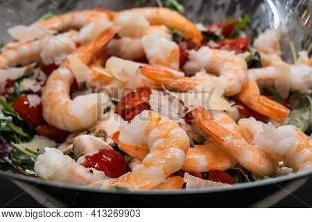 Arugula Or Rocket Salad With Prawns Or Shrimps, Tomato, Parmesan Cheese And Button Mushrooms, Served
