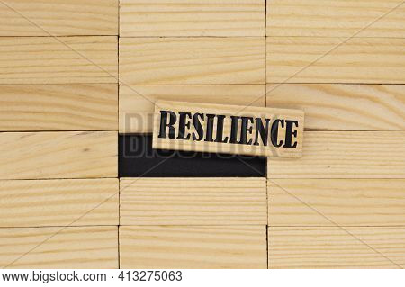 The Word Resilience Among The Wooden Bars.