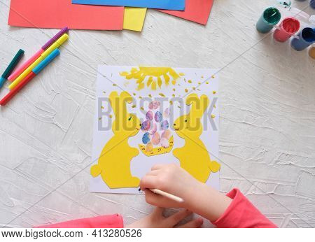 Child Making Card With Easter Bunnies  From Colorful Paper. Applique. Handmade. Project Of Children'