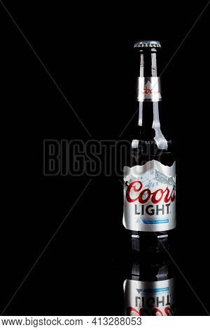 Sandhurst, United Kingdom, 18th March 2021:- A Bottles Of Coors Light Isoalted On A Black Background