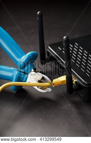 Cutting And Disconnecting The Network Internet Connection With Cutting Pliers.