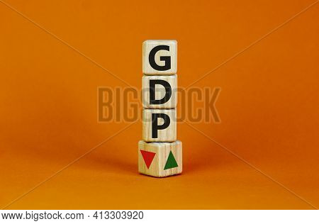 Gdp, Gross Domestic Product Symbol. Wooden Cubes With Up And Down Icon. Word 'gdp'. Beautiful Orange