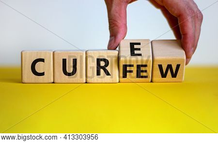 Curfew And Cure Symbol. Businessman Turns Cubes And Changes The Word 'curfew' To 'cure'. Beautiful W