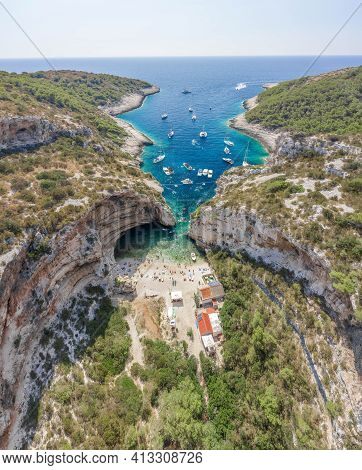 Aerial Drone Shot Of Iconic Stiniva Cove Beach Of Adriatic Sea On Vis Island In Croatia Summer