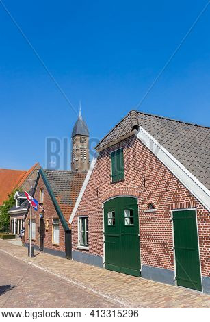 Street With Old Houses And Church Tower In Rijssen, Netherlands