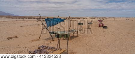 Typical Roadside Scene Where You Can Stop And Buy Stone Souvenirs At Dorob National Park In Namibia.