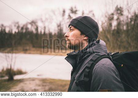 Lonely Sad Man, Standing With His Back And Looking At Frozen Lake Inforest. Depression, Bad Mood And