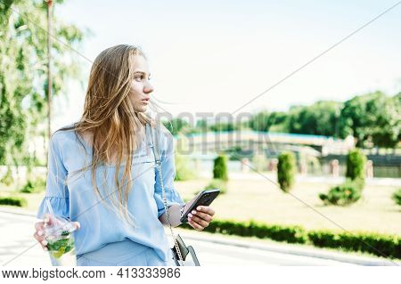 Summer Non-alcoholic Drink, Refreshing Cold Drink. Young Blond Woman Drinking Non-alcoholic Mojito I