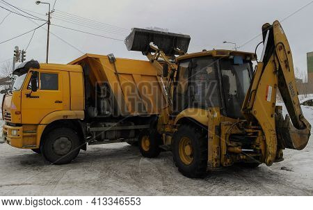 Ust-kamenogorsk, Kz - Feb 7, 2021. Russian Truck Kamaz 6520, Front Bucket Loader.