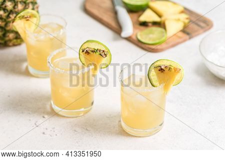 Pineapple Margarita Cocktail. Summer Boozy Refreshing Drink With Tequila, Pineapple In Glasses With 