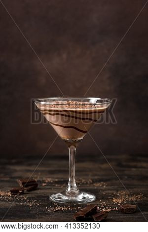 Chocolate Truffle Martini Cocktail On Dark Wooden Background, Copy Space. Mudslide Truffletini Cockt