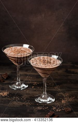 Chocolate Truffle Martini Cocktail On Dark Wooden Background, Copy Space. Mudslide Truffletini Cockt