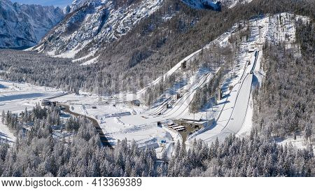 Aerial View Of Ski Jump In Planica, Slovenia At Ratece Near Kranjska Gora In Winter With Snow.
