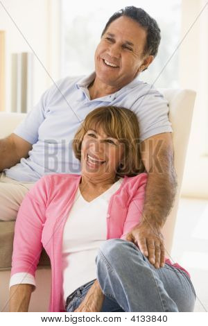 Couples In Living Room Smiling