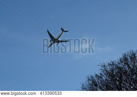 Ecouen, France - 20/02/2021 : International Flight In A Blue Sky