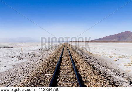 Train Tracks Perspective View From Bolivia. Bolivian Landscape. Salar De Colchani