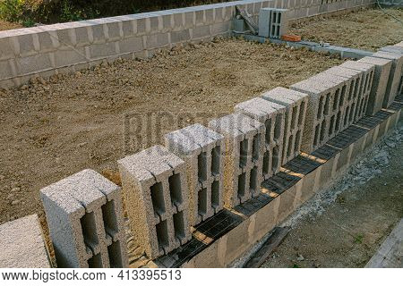 Hollow  Heavy Concrete Blocks For Construction Of Stone Walls Building. Masonry Walls Made Of Heavy 