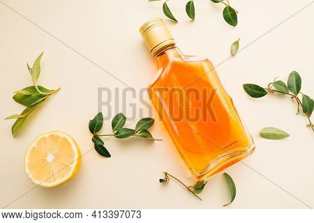 Flat Lay Of Cold Refreshing Summer Alcohol Cocktail With Fresh Lemon , Orange Mint And Ice Bottle Ov
