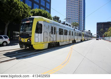Long Beach, California - USA - March 15, 2021: Los Angeles Metro Blue Line in Downtown Long Beach California. Metrolink Train System transports people around in Southern California. Editorial use only