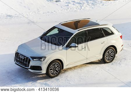 Novyy Urengoy, Russia - March 6, 2021: White Luxury Crossover Audi Q7 (4m) In The City Street.