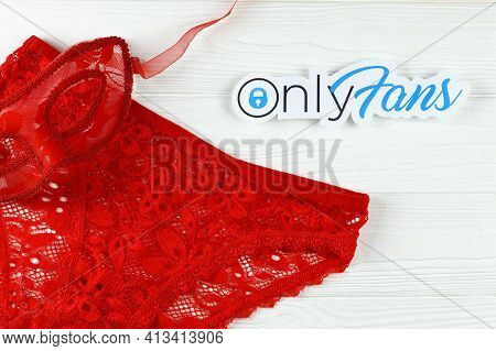 Kharkov, Ukraine - February 14, 2021: Onlyfans Paper Logo And Red Lingerie. Onlyfans Is Content Subs