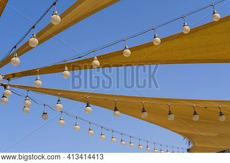 Dynamic Texture Of Fabric Stretch Roof Made Of Canvas Sail With Rows Of Bulb Lamps For Party Night L