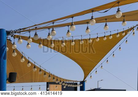 Dynamic Texture Of Fabric Stretch Roof Made Of Canvas Sail With Rows Of Bulb Lamps For Party Night L