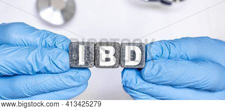Ibd Inflammatory Bowel Disease - Word From Stone Blocks With Letters Holding By A Doctor's Hands In