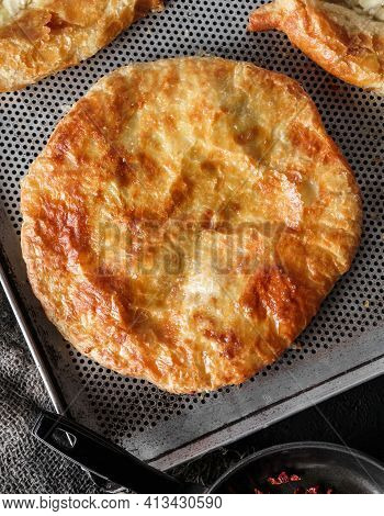 Traditional Homemade Romanian And Moldovan Round Pies - Placinta, Served On A Plate, Dark Background