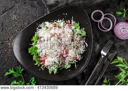Gourmet Appetizing Vegetable Salad With Cheese, Salad Leaves And Parsley. Shopsky Salad In A Bowl Ov