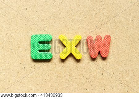 Foam Alphabet Letter In Word Exw (abbreviation Of Ex Works)  On Wood Background