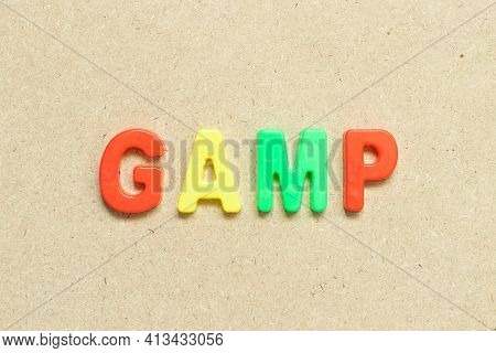 Color Alphabet Letter With Word Gamp (abbreviation Of Good Automated Manufacturing Practice) On Wood
